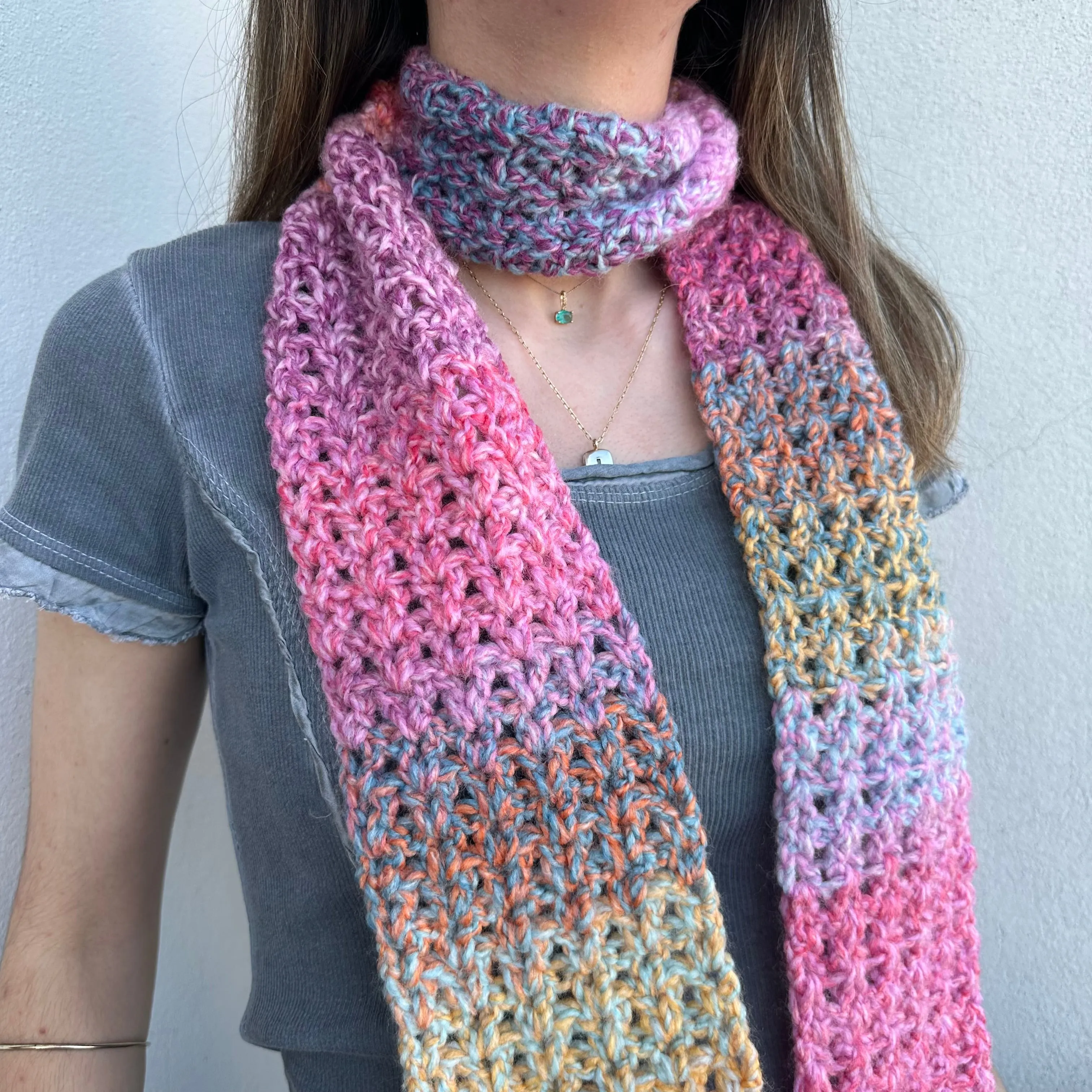 Handmade multicoloured ombré crochet scarf in pink, purple, orange and yellow