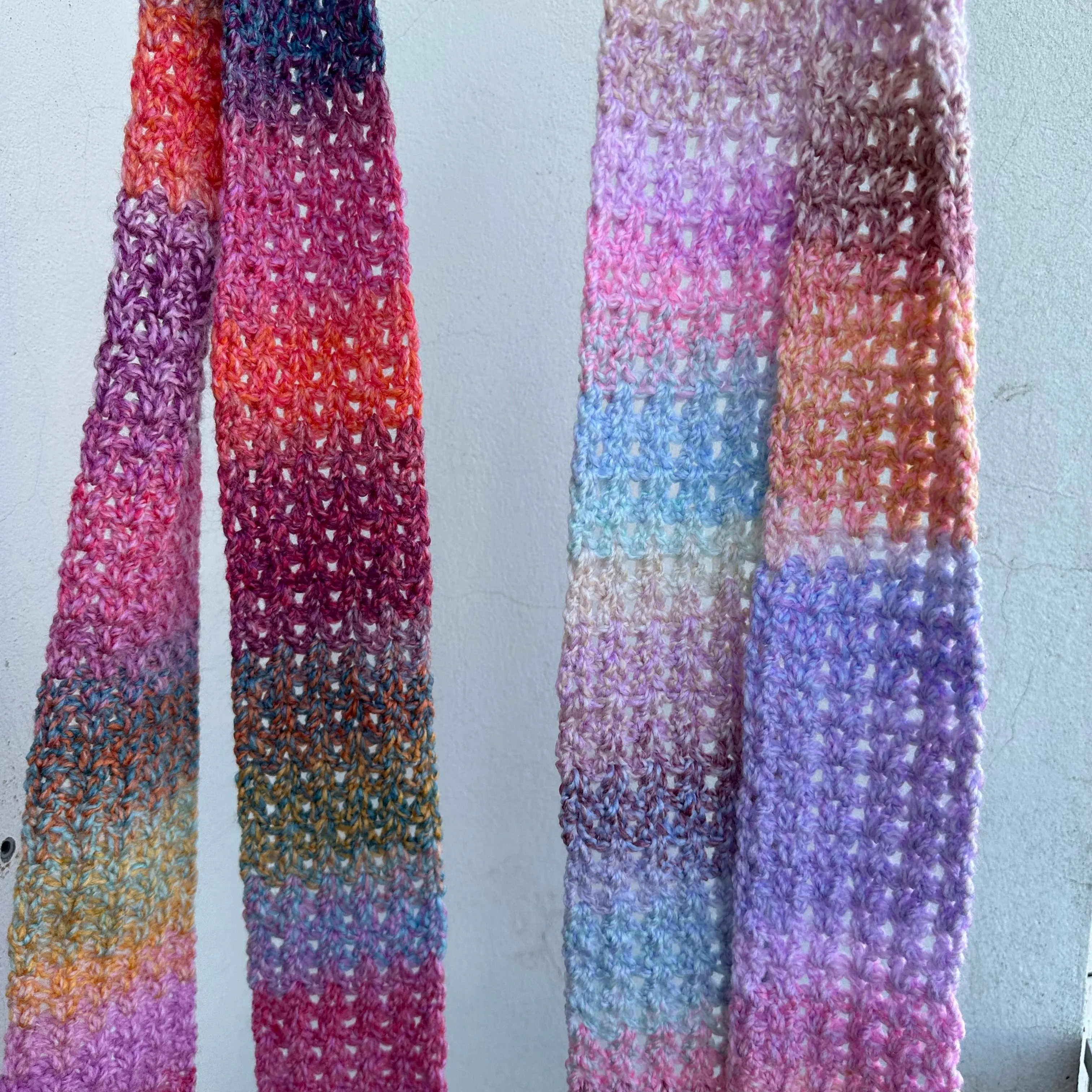 Handmade multicoloured ombré crochet scarf in pink, purple, orange and yellow