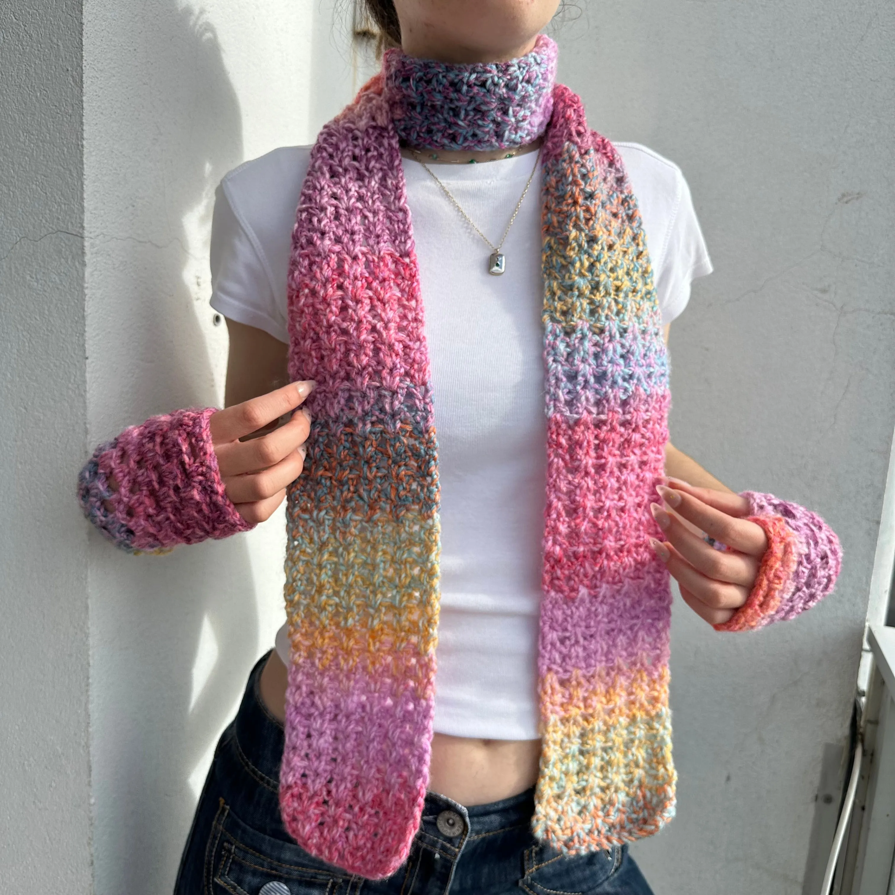 Handmade multicoloured ombré crochet scarf in pink, purple, orange and yellow